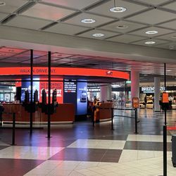 Sixt Rent A Car - Booth with electronic kiosk to check in first before speaking to staff