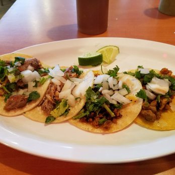Taqueria Jacarandas - 4 taco plate with carnitas adobada and chorizo. - Mexican Near Me - SeaTac, Washington Taqueria Jacarandas - 4 taco plate with carnitas adobada and chorizo. - Mexican Near Me - SeaTac, Washington