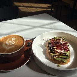 Latte w/cinnamon and Shotted avocado toast Latte w/cinnamon and Shotted avocado toast
