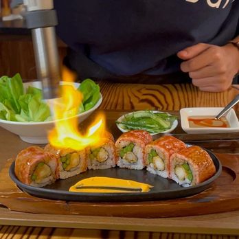 Momosan Ramen Boston - Wagyu roll being prepared - Bars Near Me - Boston, Massachusetts Momosan Ramen Boston - Wagyu roll being prepared - Bars Near Me - Boston, Massachusetts