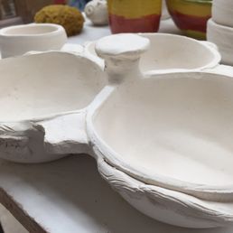 Before glaze, created a 3 piece bowl set with tree branch decorations