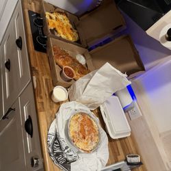 Milanos Pizza and Italian Restaurant - Cheese Bread, House Stromboli, (bagged) breadsticks with Small Chicken Parmesan and small house salad enclosed