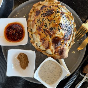 Kusan Bazaar | Silk Road Grill & Noodles 龟兹集市 - Wellington-Style Roasted Lamb Shank - Halal Near Me - Milpitas, California Kusan Bazaar | Silk Road Grill & Noodles 龟兹集市 - Wellington-Style Roasted Lamb Shank - Halal Near Me - Milpitas, California