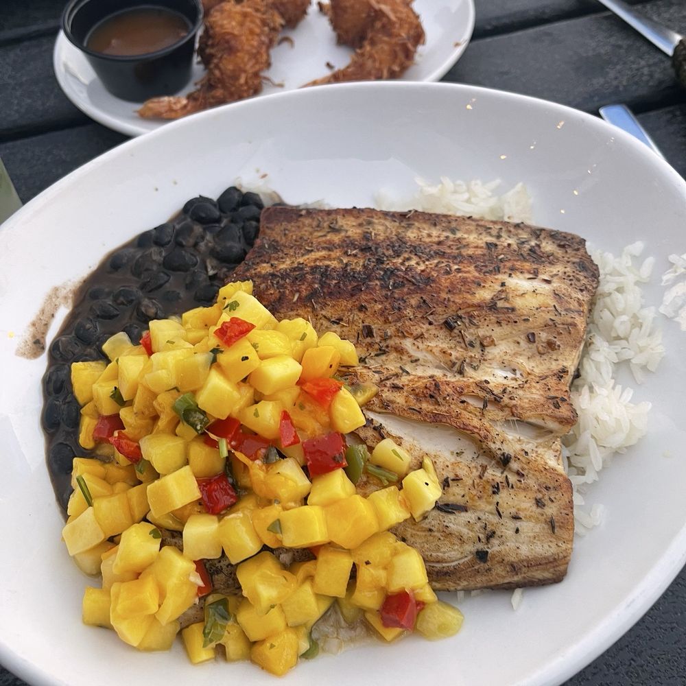 Coconuts On The Beach - Jerked Mahi with beans and mango salsa - Bars Near Me - Cocoa Beach, Florida Coconuts On The Beach - Jerked Mahi with beans and mango salsa - Bars Near Me - Cocoa Beach, Florida