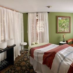 Heart Rock Healing Wellness - The massage room equipped with healing modalities like crystal bowls and tuning forks for ultimate relaxation and healing.