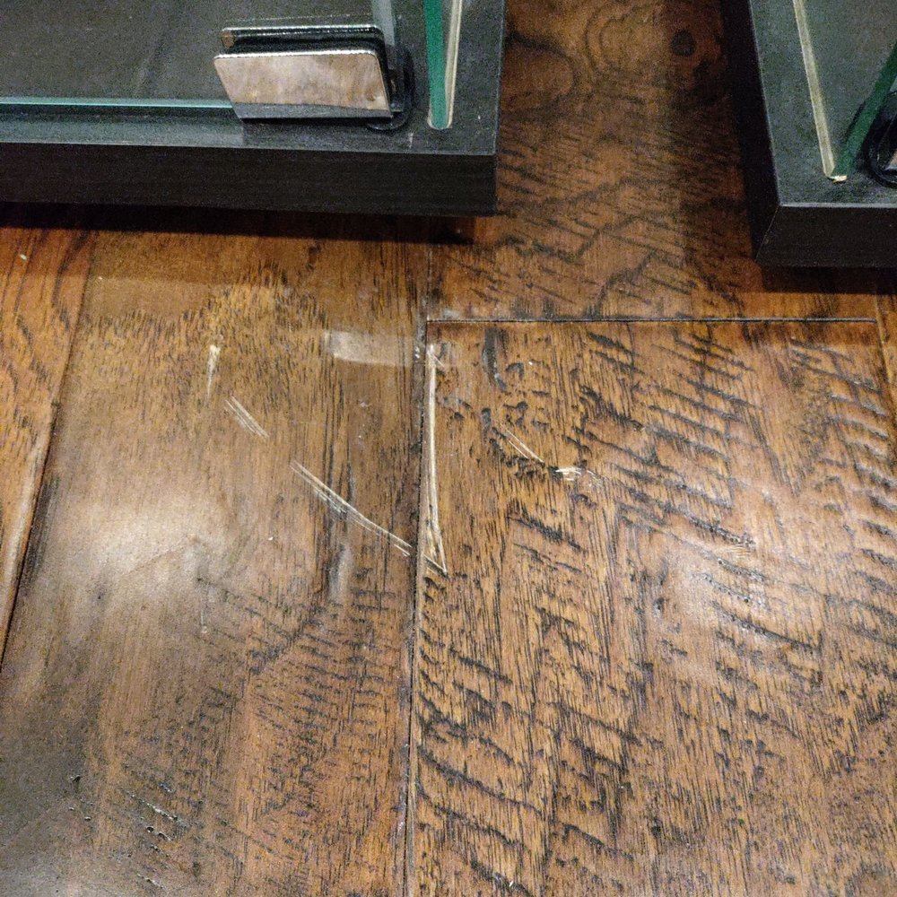 Scratched brand new wood floors.