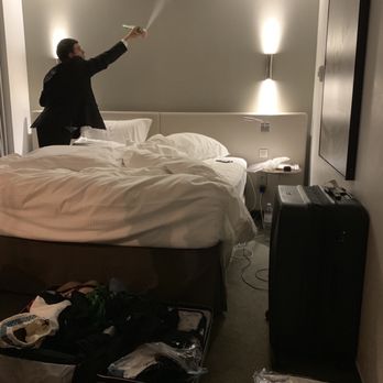 Hôtel Pullman Paris Eiffel Tower - Rep applying bug spray over head of bed - Hotels Near Me - Paris, 75 Hôtel Pullman Paris Eiffel Tower - Rep applying bug spray over head of bed - Hotels Near Me - Paris, 75