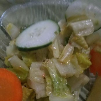 Amasi Restaurant and Hookah - Wilted old drowned "salad" that we never ordered. Lettuce was olive green, yellow and brown. Soaked in some watery liquid. - Mediterranean Near Me - Philadelphia, Pennsylvania