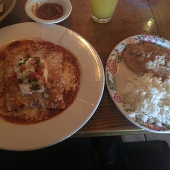Julio's Restaurant - Chicken Enchiladas on the Left, Rice and refried beans on the Right. - Mexican Near Me - Bothell, Washington Julio's Restaurant - Chicken Enchiladas on the Left, Rice and refried beans on the Right. - Mexican Near Me - Bothell, Washington