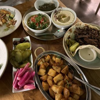 Ammatoli - Pickles, batata hara, beef shawerma, ful madamas, hummus, and dolma - Mediterranean Near Me - Long Beach, California