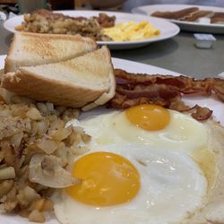 Curly's Family Restaurant - Two eggs with bacon, white toast and home fries!