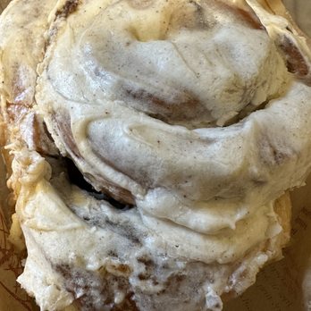 Happy Bakery - a cinnamon roll with icing - Desserts Near Me - West Chester, Pennsylvania