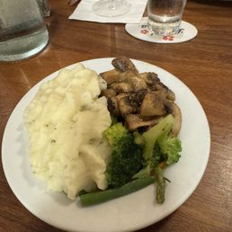 The side dish mixed veggies mushrooms and garlic mashed potatoes