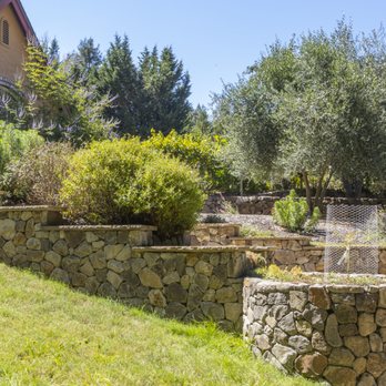 Permaculture Artisans - a garden with a fountain - Landscaping Near Me - Sebastopol, California