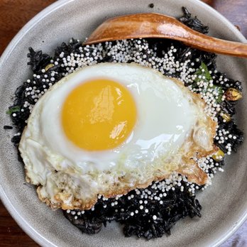 The Tyger - Nasi Goreng (Crispy Squid Ink Fried Rice with Calamari and Fried Egg) - Cocktail Bars Near Me - New York, New York The Tyger - Nasi Goreng (Crispy Squid Ink Fried Rice with Calamari and Fried Egg) - Cocktail Bars Near Me - New York, New York