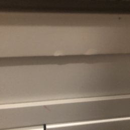 As the damage in the front panel bottom cabinet a.k.a. By the sink