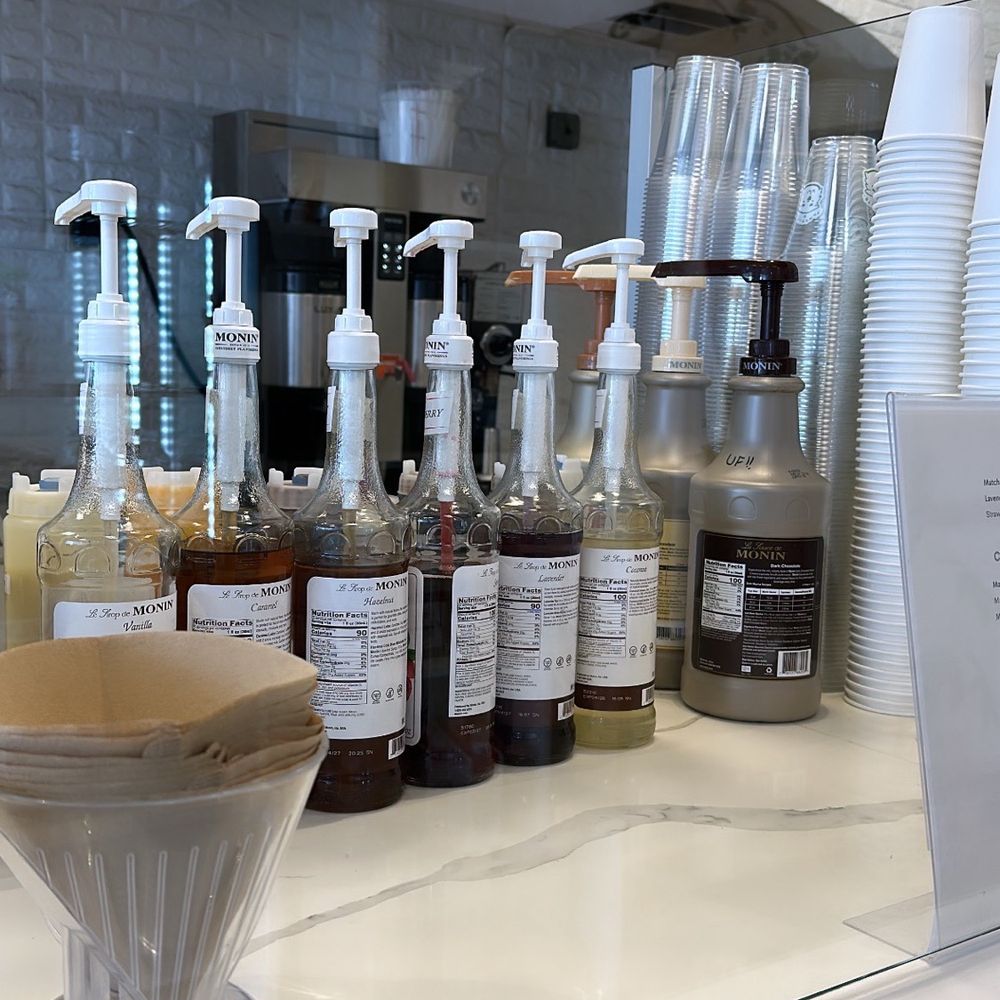 Flat White Coffee - [BACK BAR] Monin products are used. I find them to be of better quality & flavor over Torani products. Great choice! - Cafes Near Me - Cypress, California