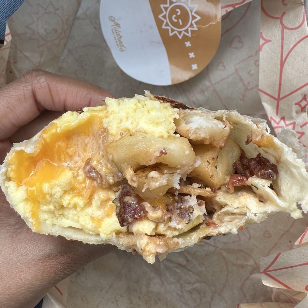 Chipotle Breakfast wrap. Eggs, cheese, bacon, potatoes, chipotle sauce.
