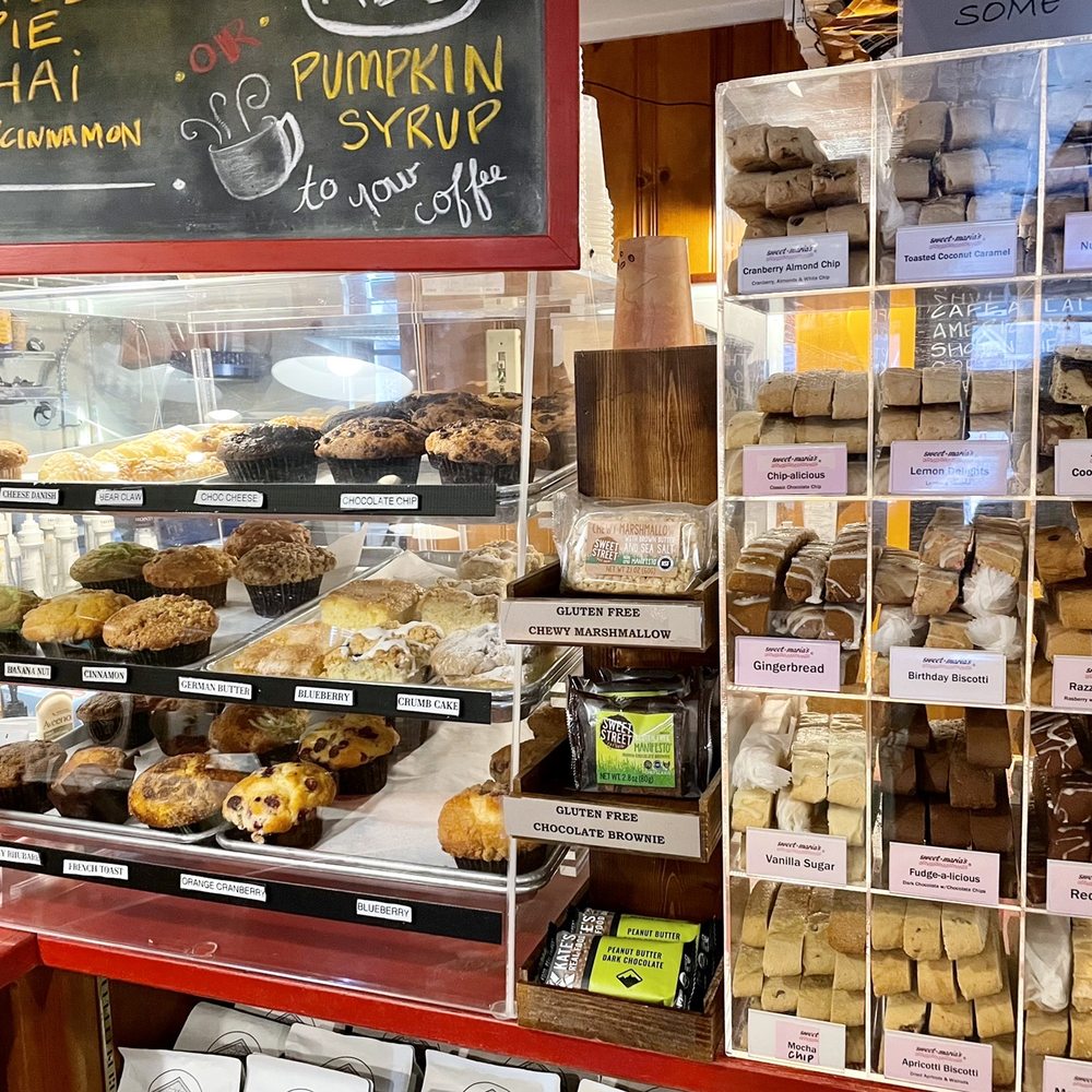 Duck's Cottage Coffee & Books - Eye candy ha! Muffins, baked goods and a whole case of flavored biscottis, say no more! - Coffee & Tea Near Me - Duck, North Carolina