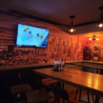Long Acre Tavern - a large screen tv in the background - Sports Bars Near Me - New York, New York Long Acre Tavern - a large screen tv in the background - Sports Bars Near Me - New York, New York