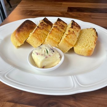 Restaurant Claudine - "Grandma's cornbread" with smoked wallflower butter - French Near Me - San Antonio, Texas Restaurant Claudine - "Grandma's cornbread" with smoked wallflower butter - French Near Me - San Antonio, Texas