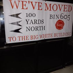 Bin 605 Fine Wine & Spirits - Big sign saying they moved next door