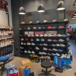 Red Rock Running Company - One wall of shoes
