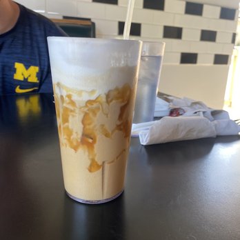 Traverse Bay Cafe - Iced latte with maple and Carmel syrup topped with vanilla cold foam - Cafes Near Me - Traverse City, Michigan Traverse Bay Cafe - Iced latte with maple and Carmel syrup topped with vanilla cold foam - Cafes Near Me - Traverse City, Michigan