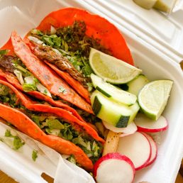 a close up of a taco in a styrofoam container