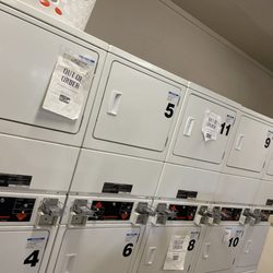 Mill Street Village - Numerous out of order signs on dryer machines indicate most of the machines do not function.