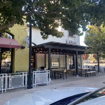 SloDoCo Donuts - The Front with outdoor games and seating - Donuts Near Me - Atascadero, California