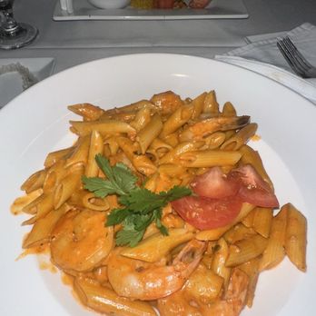 Grand Cafe Key West - Truffle Shrimp Penne Other side - Snapper ,yellow rice lobster wine sauce (House special 50$) - New American Near Me - Key West, Florida Grand Cafe Key West - Truffle Shrimp Penne Other side - Snapper ,yellow rice lobster wine sauce (House special 50$) - New American Near Me - Key West, Florida