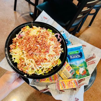 Giovanni's Pizza - a hand holding a plate of pasta - Pizza Near Me - Marysville, Ohio Giovanni's Pizza - a hand holding a plate of pasta - Pizza Near Me - Marysville, Ohio