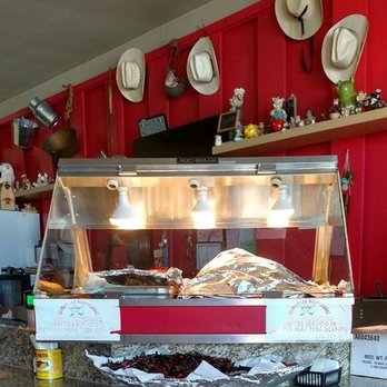 Carnitas Las Michoacanas - Meat wrapped in foil under a heated display rack - Mexican Near Me - Chula Vista, California Carnitas Las Michoacanas - Meat wrapped in foil under a heated display rack - Mexican Near Me - Chula Vista, California