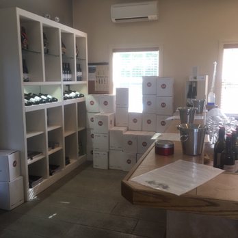 Moraine Estate Winery - a wine cellar with boxes of wine - Wineries Near Me - Penticton, British Columbia