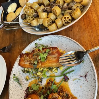 Jellyfish Crudo + Charbon - Braised crispy pork belly (front), Rotelle (back). - Modern European Near Me - Montreal, Quebec Jellyfish Crudo + Charbon - Braised crispy pork belly (front), Rotelle (back). - Modern European Near Me - Montreal, Quebec