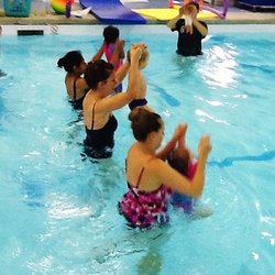 Little Dolphins Swim Academy - Baby and Me class Building strength is a key to swim safety.