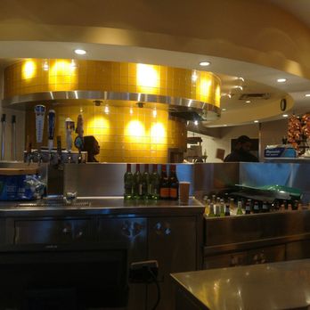California Pizza Kitchen - Partial view of the kitchen from the bar. - Pizza Near Me - Atlanta, Georgia California Pizza Kitchen - Partial view of the kitchen from the bar. - Pizza Near Me - Atlanta, Georgia