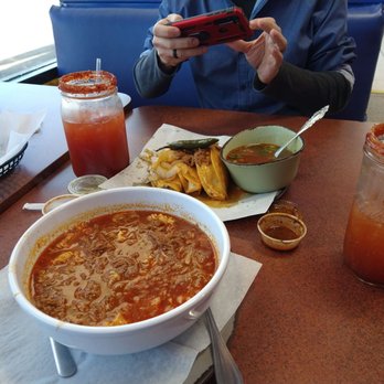 El Camaron Vaquero - a man taking a picture of his food - Mexican Near Me - Dixon, California