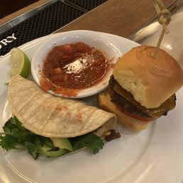 Kau'aina Tacos and Bacon Cheeseburger Sliders- not entire dish shown Kau'aina Tacos and Bacon Cheeseburger Sliders- not entire dish shown