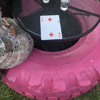 Pink Flamingo - two people sitting at a table with playing cards on it - Food Trucks Near Me - Detroit, Michigan