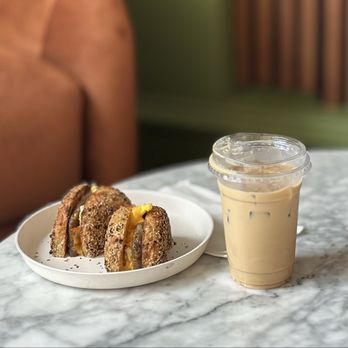 Public Espresso - Sausage egg and a cheese breakfast sandwich on everything bagel with a large iced latte with orange blossom syrup - Coffee & Tea Near Me - Buffalo, New York Public Espresso - Sausage egg and a cheese breakfast sandwich on everything bagel with a large iced latte with orange blossom syrup - Coffee & Tea Near Me - Buffalo, New York