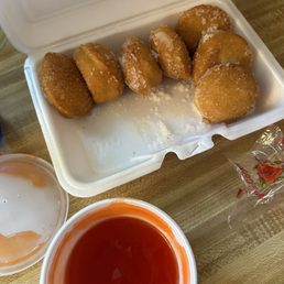 Sugar donut and sweet and sour sauce Sugar donut and sweet and sour sauce