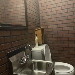 Stoney's Dinner Bell - Very small restrooms- I am as far against the door as possible and toilet is up a step. Very clean though!