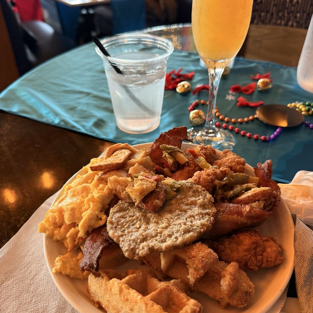 Buffet breakfast - waffles, eggs, chicken, potatoes, sausage, mini quiche, bacon, Bellini Buffet breakfast - waffles, eggs, chicken, potatoes, sausage, mini quiche, bacon, Bellini