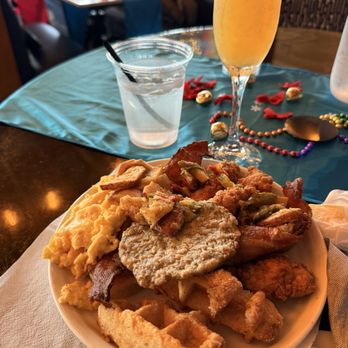 Chapman & Kirby - Buffet breakfast - waffles, eggs, chicken, potatoes, sausage, mini quiche, bacon, Bellini - Gastropubs Near Me - Houston, Texas