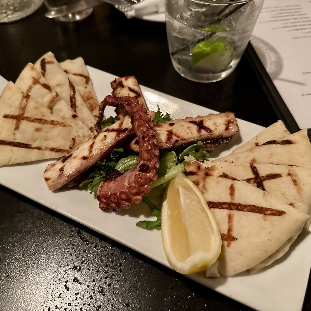 Demi's - GRILLED OCTOPUS marinated in red wine vinegar, herbs and olive oil - Mediterranean Near Me - Richmond, Virginia