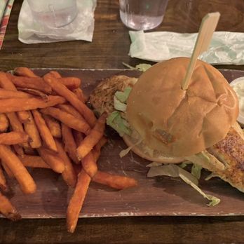 Gilligan's Island Bar & Grill - The Market Red Snapper fish sandwich with sweet potato fries as the side. Fantastic!! - American Near Me - Siesta Key, Florida