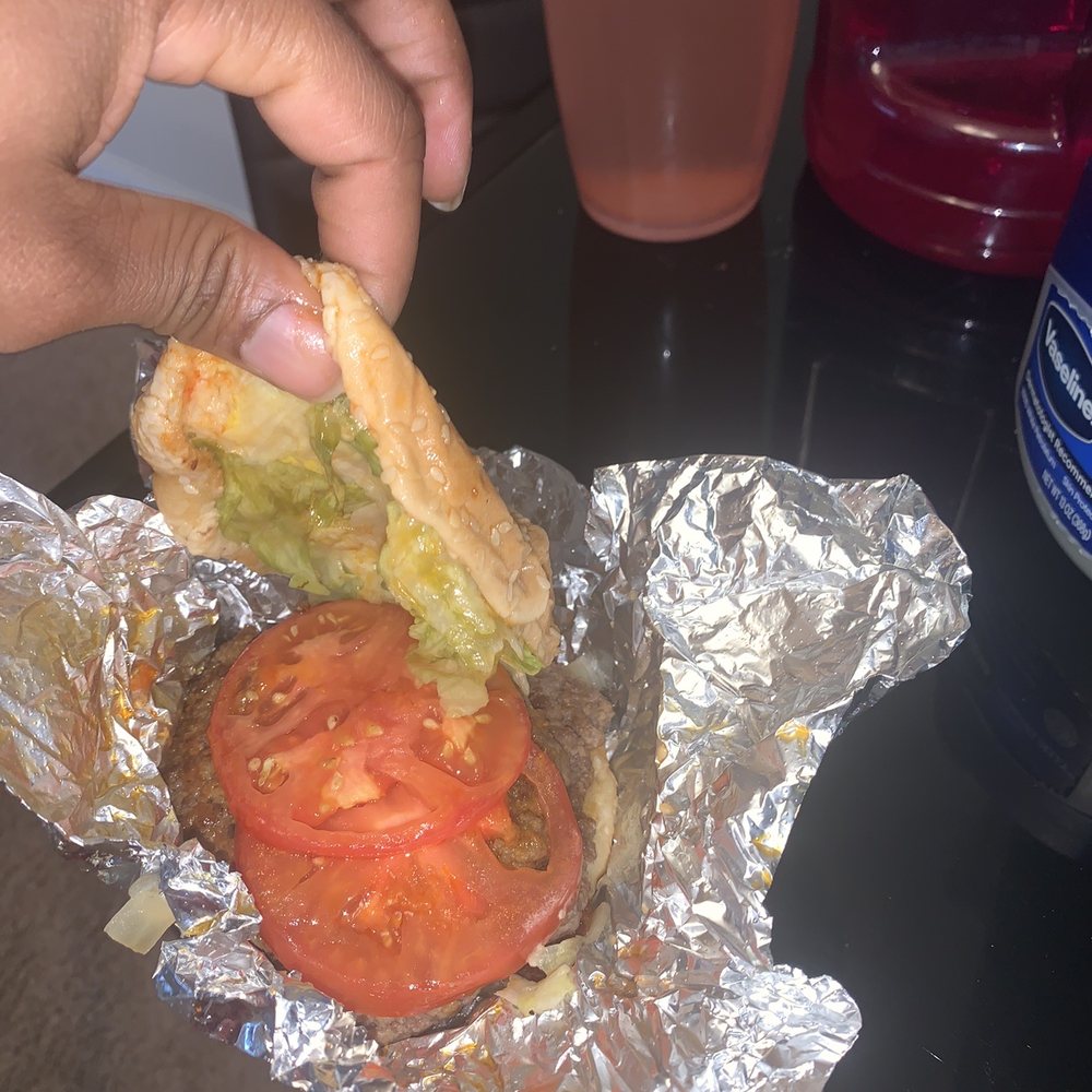 a sandwich with a tomato and lettuce