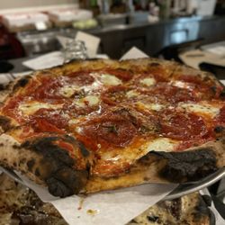 Pepperoni with scamorza, garlic, chilies, fresh mozzarella, + herbs